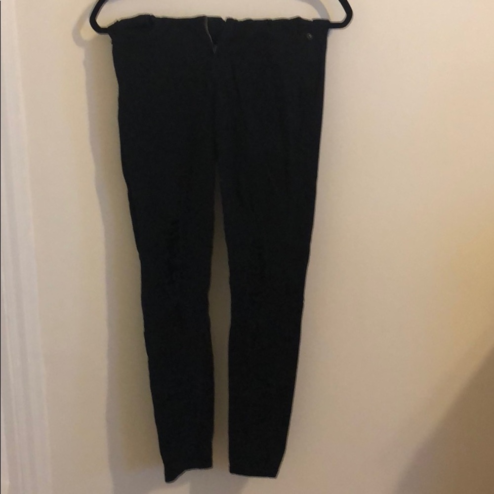 High-waisted, black, ripped jeans